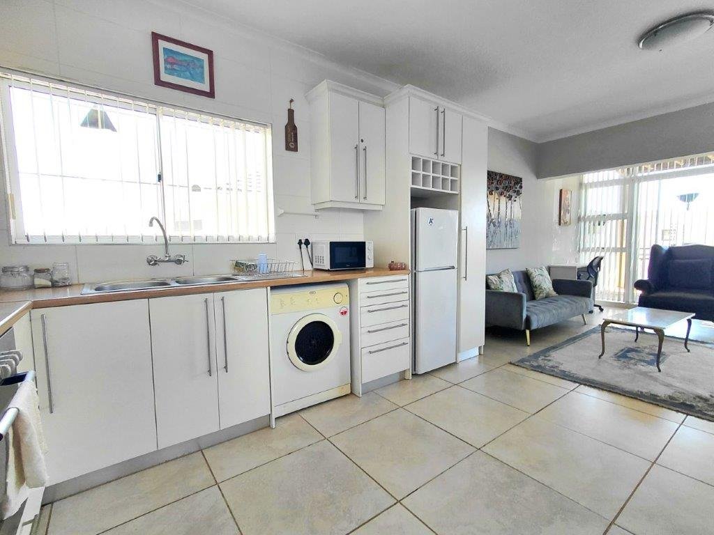 1 Bedroom Ground Floor Apartment for Sale in Strand – Walk to Beach, Lock-Up Garage & Airbnb Potential